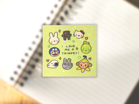 Sticker with simplified versions of cartoon characters Hello Kitty, Smiski, Banana Sonny Angel, Totoro, Snoopy, Doraemon, Miffy, and Domo on a light green background. Text in the middle reads 'I LOVE ME A TRINKET!" Subtle holographic star lamination on the sticker.